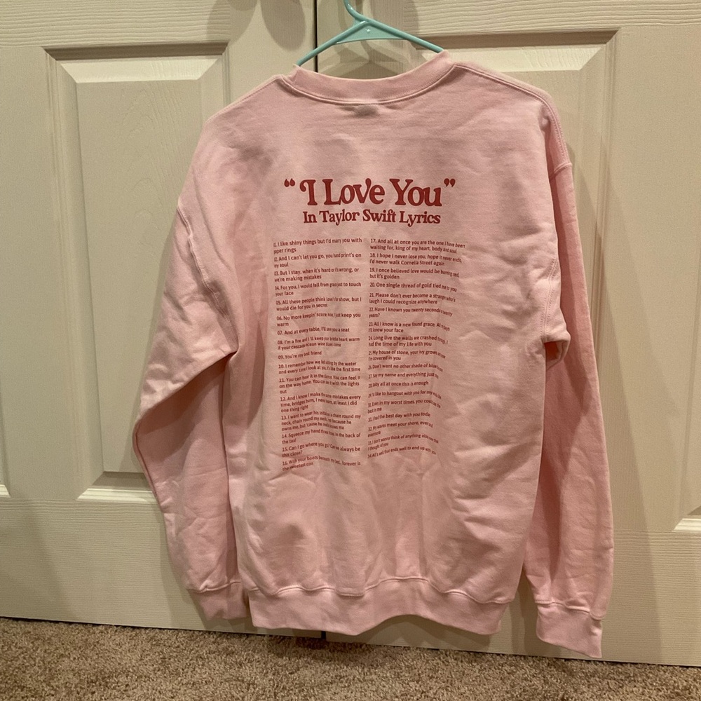 “I love you” in Taylor Swift lyrics light pink crewneck